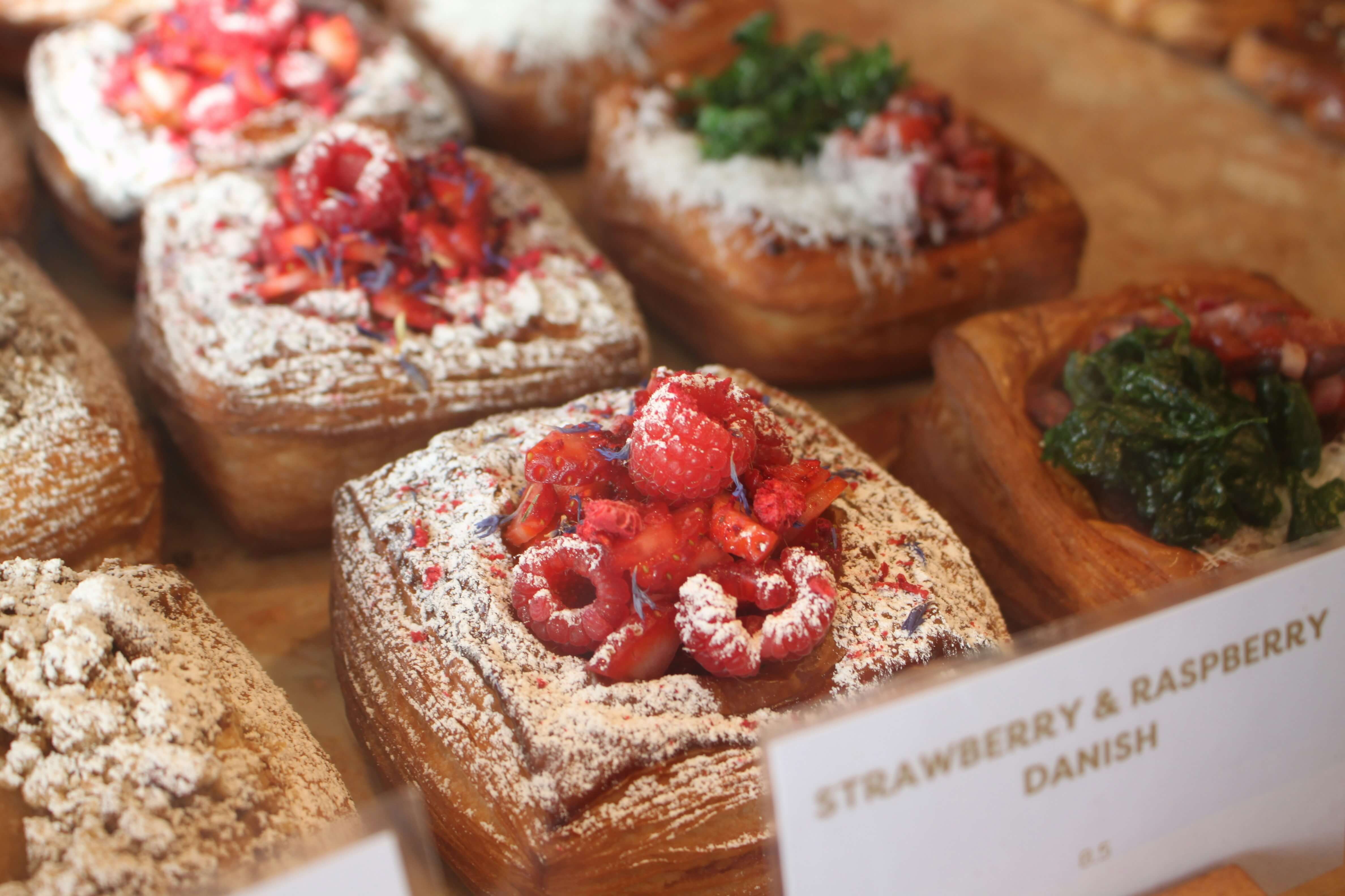 Assortment of freshly baked pastries including croissants and danishes