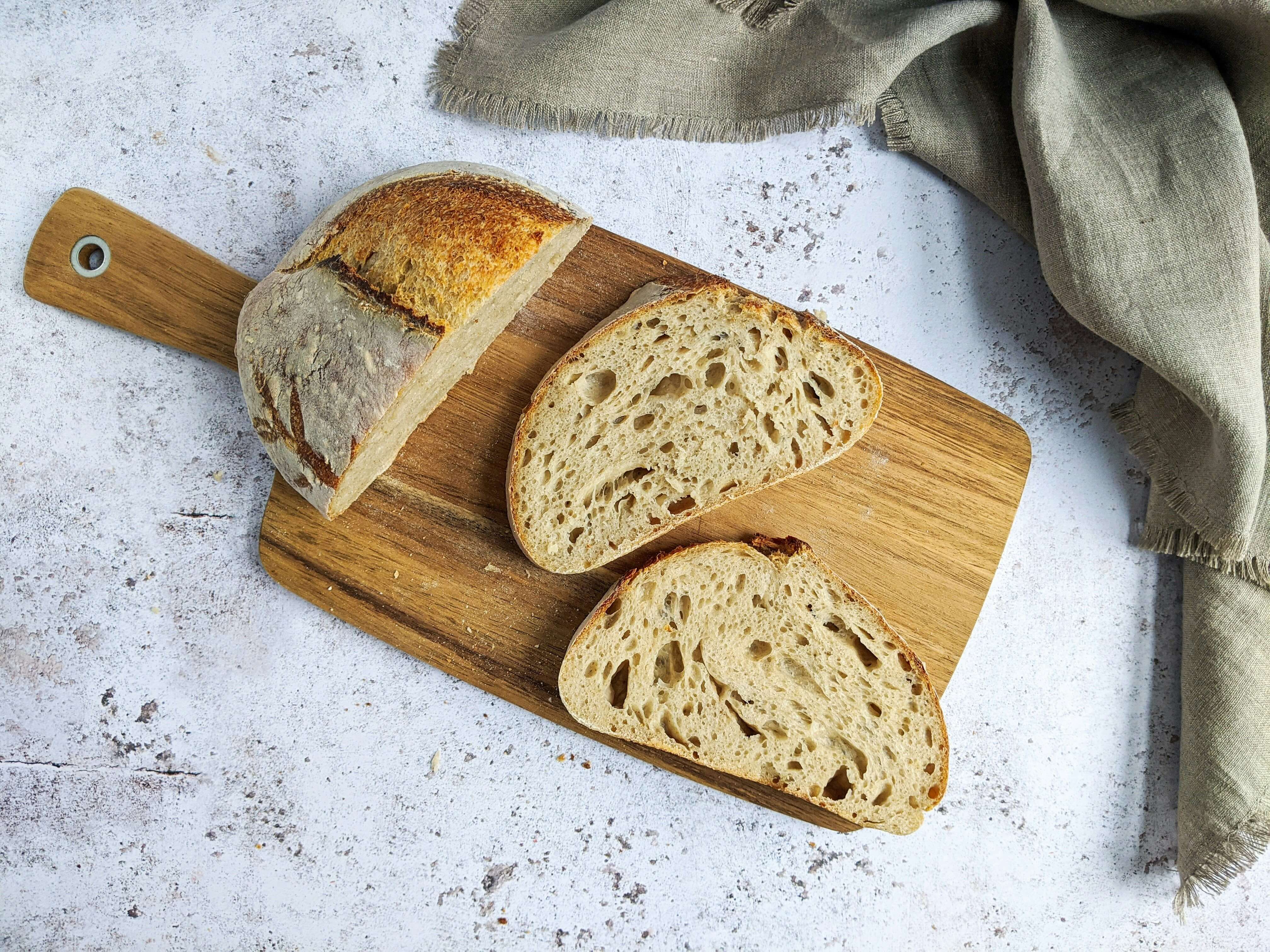 Freshly baked artisanal sourdough bread with a golden crust